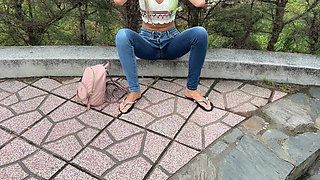 Public Wetting Jeans in Park Near the Beach