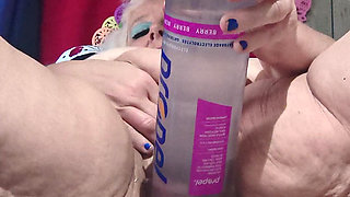 Big Bottle Plugged Clit Cunt