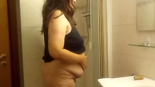 Mature chubby woman in the shower  big belly can be seen well