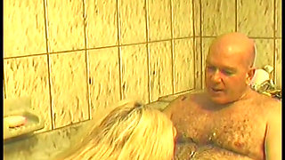Blonde stretches her cunt with big dildo before bathroom doggy style fuck