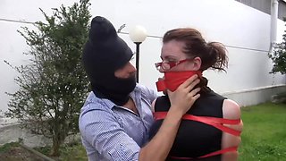 italian brunette captured and taped up close to car