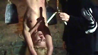 Witch Hangs Upside Down and Gets Drizzled with Black Wax