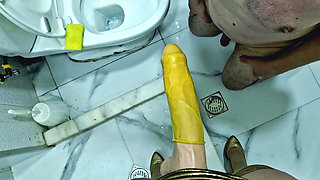 A slave is cleaning a dirty toilet when Dominatrix Nika comes to him with a strap-on and makes him take the strap-on in his mout