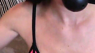 Stunning Brunette in Sexy Neon Pink Bikini and Leather Boots Ballgags Herself