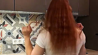 The Juggler Girl Is Here in a Long School Type Uniform Skirt to Flash Her Panties Under Her Miniskirt in the Kitchen