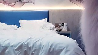 Cute amateur asian web cam girl playing with her toy