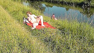 Nudist Beach. Public Nudity. Sexy Milf Without Panties And Bra Sunbathes Naked Is Not Shy About Fisherman. Naked In Public. Milf