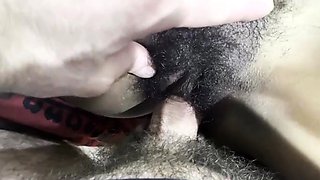 Cumshot on hairy black pussy