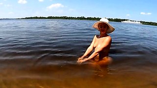 Blonde Solo Nudist Shows Off Tattoos by the River