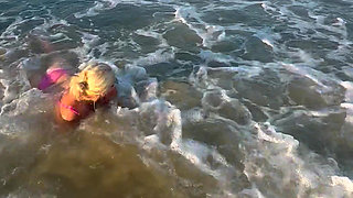 Try Not to Wet My Hair While Play with the Waves