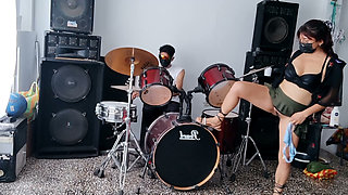 Best female friend performs a sexy dance for her male friend while he plays the drums.