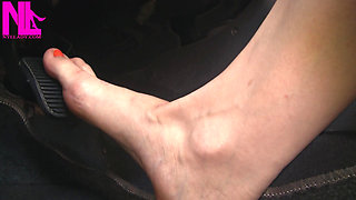 Nyllady with Her Bare Foot on Gas Pedal Driving