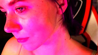 Redheaded pierced teen close up toy show