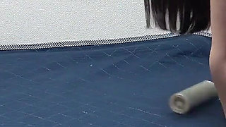 Girls Only Apartment in Japan, a Room Where a Girl Is Cleaning in a Too-short T-shirt, Miniskirt and Thong Panties