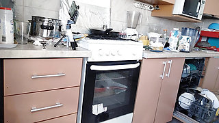 Amateur wife prepares breakfast naked in the kitchen.