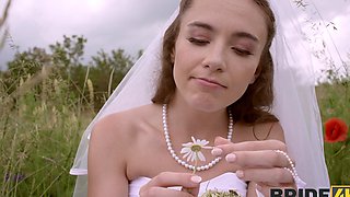 A bride in white satin lingerie has sex with her husband outdoors