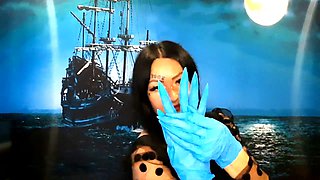 Dominatrix Nika with a glove fetish puts on medical gloves and destroys them with her long tools