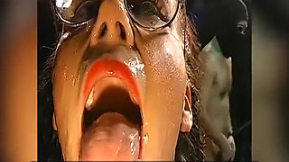 Bukkake Slut with Glasses Gets Her Face Drenched in Cum