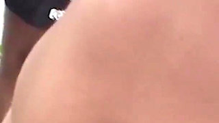 My wife participates in an orgy on the beach. She sucks cock several men