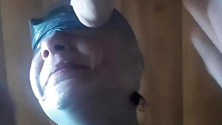 Second View of a MILF Hooded in Nylon, Blindfolded with Duct Tape, Facialized, and Cummed in Mouth