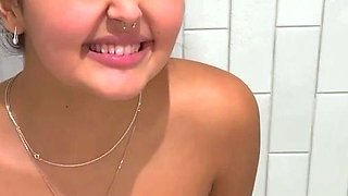 Busty babe playing with her big boobs