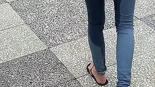Public Wetting Jeans in Park Near the Beach