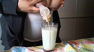 Hot babe with big boobs playing with her lactating boobs