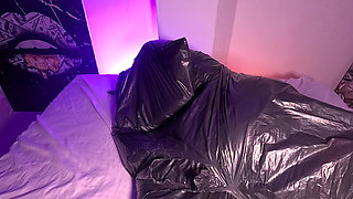 Girl in Garbage Bag Plays with Her Breath