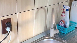 Hair Wash with Dishwasher Liquid in Kitchen Sink