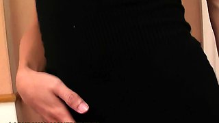 Brunette ladyboy in black dress plays with her small cock