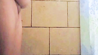 Mature grandmother taking a nice shower