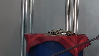 Mistress Whips Male Masochist Who Is Holding Dildo in His Mouth to Prevent It From Falling Out of Female Masochist Pussy