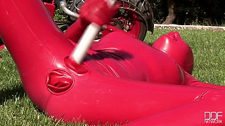 Busty babe toying in full latexwear