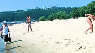 Hot nudist teen filmed by voyeur as she sits naked outside