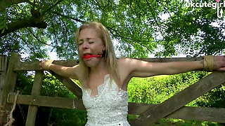 Damsel Tied to Gate Crucifix Bondage & Ballgagged