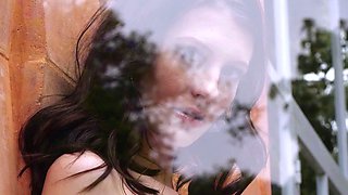 Petite brunette babe reveals juicy boobs
