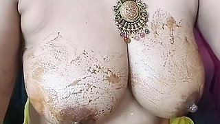 Secretly Watched the Beautiful Indian Stepmother Massaging Her Large Breasts with Oil and Chocolate. Dirty Talk in Hindi
