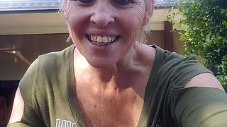 Blonde is flashing her big boobs in the outdoors