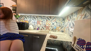 The Juggler Girl Is Here in a Long College Type Uniform Skirt to Flash Her Panties Under Her Miniskirt in the Kitchen