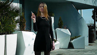 Young Russian Girl Smoking Cigarette by Seaside