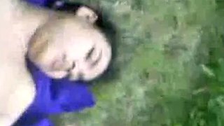 Malaysian babe outdoors with political party flags.