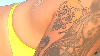 Tattooed MILF Nery Takes Hard Doggy Pounding on Beach