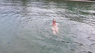 Sexy Granny Swims Naked in a Lake!
