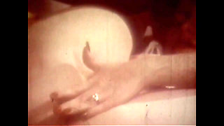 Vintage Redhead with Huge Boobs and Black Stockings Has Solo Sex in Her Bed